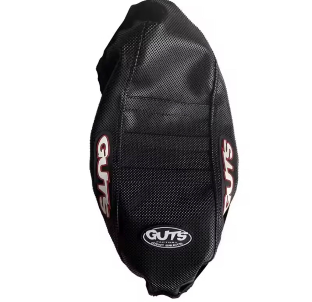 Surron LBX seat cover featuring aggressive ribbed design by Guts Racing for enhanced grip and control.