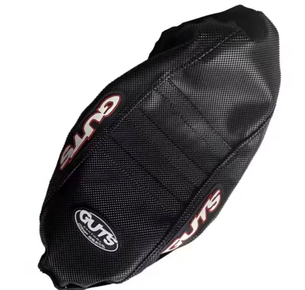 Surron LBX seat cover featuring aggressive ribbed texture for enhanced grip and stability during rides.