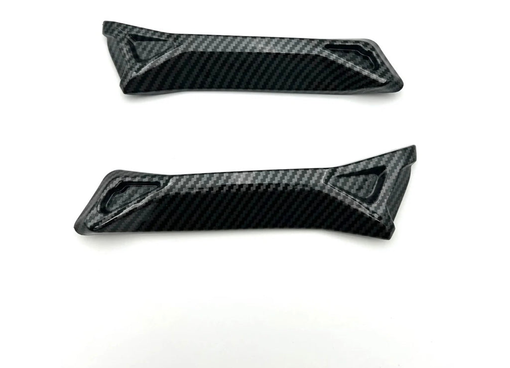 carbon fiber battery guards for Surron Ultra Bee showcasing high-gloss finish and aggressive styling.
