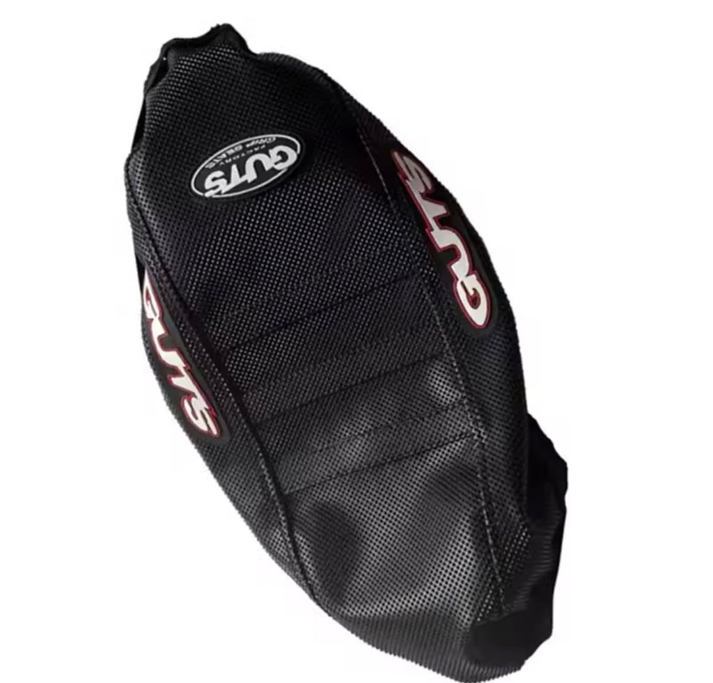 Surron LBX seat cover showing the aggressive ribbed traction design for improved grip on electric dirt bikes.