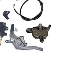 Talaria XXX foot brake kit components including pedal assembly, caliper, and brake line for enhanced stopping power.