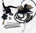 Tuttio foot brake kit featuring black components including lever, master cylinder, calipers, and hoses.