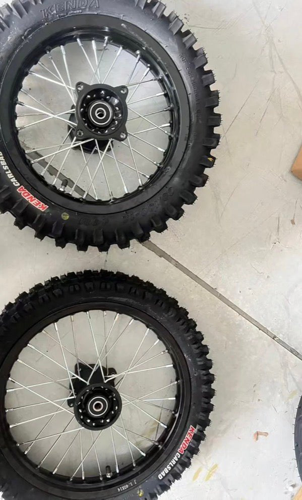 Tuttio 14/17" Dirt Wheel Set featuring Kenda tires for enhanced traction and performance on various terrains.