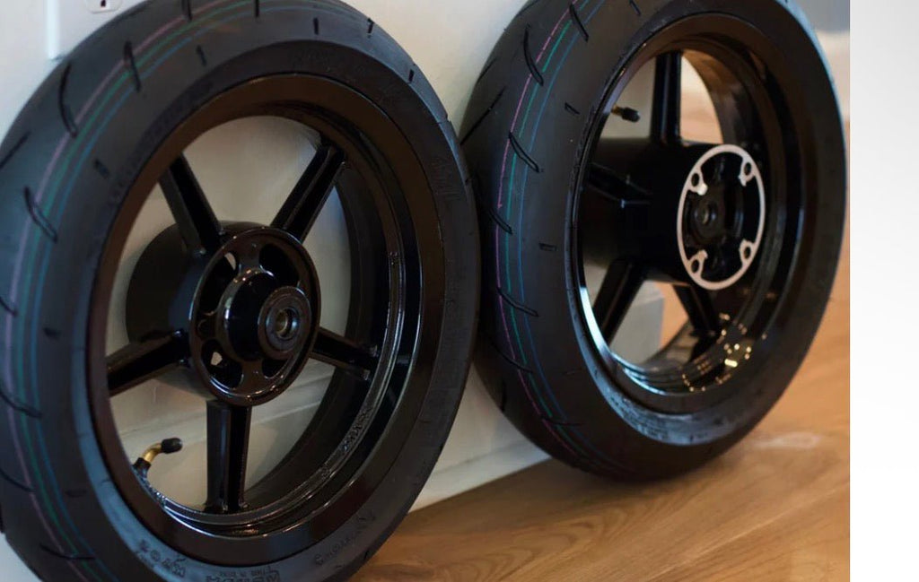 Supermoto Wheelset Kit featuring black front and rear wheels designed for performance.