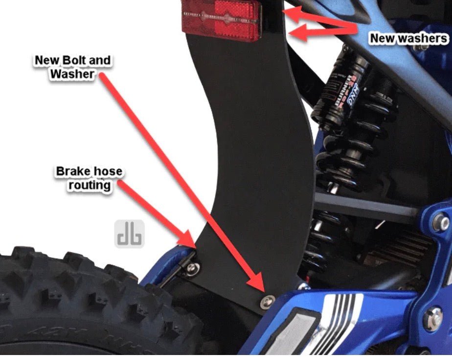 surron lbx shock protector mud guard installation details showing brake hose routing, new bolt and washer.