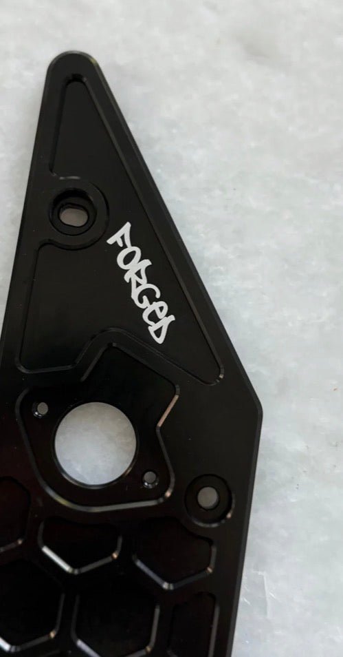 Premium V2 metal side panels for Talaria XXX showcasing Forged Racing logo and reinforced construction.