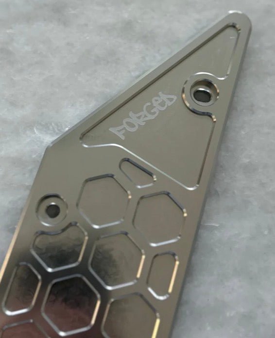 Premium V2 metal side panels for Talaria XXX featuring a glossy, reinforced metal construction and engraved logo.