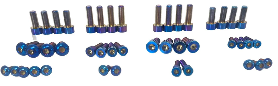 Yozma IN 10 titanium bolt kit featuring colorful titanium fasteners in various sizes.
