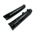 Surron Ultra Bee fork guards - shiny black OEM front suspension protectors for trail damage.