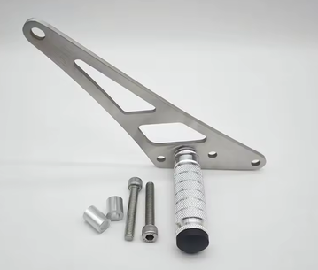 Ultra Bee Footlock parts including metal footpeg and mounting hardware on a neutral background.